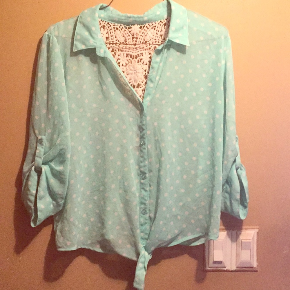 A cute blue and white polka dot blouse